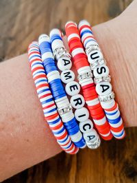 Hi there! I have a beautiful 4th of July Heishi bead bracelet bundle to celebrate Independence Day. These stacked bracelets are perfect for 4th of July or patriotic celebration, and makes a thoughtful gift. They are made of high quality clay Heishi beads and can even be personalized with the recipient's name or a special message. This is an excellent way to show someone you care and will make a lasting impression. Thanks for your interest!  Listing is for the 5 bracelet bundle. Individual bracelets are available as well.  Please refer to size chart to order your correct size. We do not offer returns/exchanges for resizing. Please include personalization details in the personalization box at checkout. The standard adult size for these bracelets is approximately 7 inches.  These custom heish