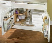 Organize a bathroom vanity using kitchen cabinet supplies...I so need to do this.