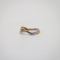 Gold and silver wave ring cross over each other, just like a couple in deep love. 18k gold plated Gold and silver color Stainless steel base Waterproof and tarnish free Available in US size 5-7 Ring sizing chart