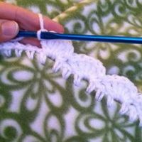 Fleece blanket with crochet edging.