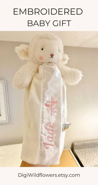 This is a personalized embroidered lamb lovey for baby gift such as baptism gift, Christening gift, Dedication Ceremony gift for baby.

The size is: 11 inches tall.
Organza drawstring bag included.
Magnetic Keepsake Gift Box available as an upgrade.

Customize this baby gift with baby's first name.

✨ FEATURES

- 11 inches tall
- Baby Safe
- Embroidered details
- Velcro loop at the back (see listing video)
- Satin lining
- 100% polyester
- Gift box included
- Machine wash cold cycle, dry low heat

✨ HOW TO ORDER

Please enter the information you would like for your lamb lovey:
1 - Select Gift Option
2 - Select Font
3 - Write thread colour and first name in personalization box
If you would like the name only and no cross, please write 'no cross'.