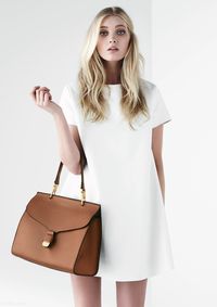 white shift dress + camel faux leather handbag