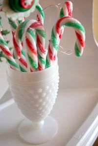 candy canes in milk glass