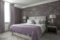 Luxury Interior Architecture and Design project by Katharine Pooley. Luxury Master Bedroom in tones of lilac. Charming chinoserie wallcovering for the headboard design.