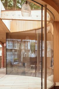 The frameless floor to ceiling bay window is just one of the curved glass structures IQ created at Lea Bridge Library. The award winning architectural design uses frameless floor to ceiling bay windows to connect the internal space to the outside. Click the image to see more pictures of these frameless floor to ceiling bay windows on our website.