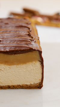 What happens when you mix your favorite childhood treat with a dessert staple? Why, this giant Twix cheesecake of course!