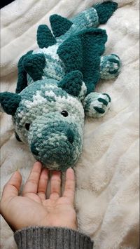 Gunther the dragon is ready for adoption. A crochet, handmade plushie dragon, perfect for any fantasy fiend.