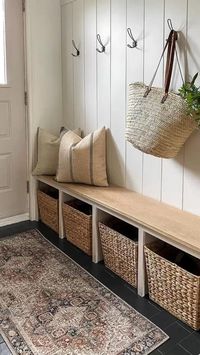 Difficulty: Easy     Design Elements:  • Cubed Storage Bench  • Neutral Wicker Bins  • Neutral Throws  • Wire Hooks   • Earth Tone Rug   • White Shiplap