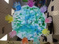 Earth Day Project with Infants....finger paint the world then put each infants hand print around the world.