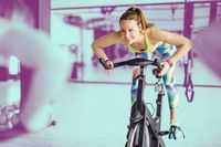 This stationary bike workout for beginners and experienced cyclers alike combines sprints and climbs for a spin class at home.