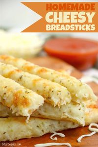 Homemade Cheese Sticks - Delicious garlic pizza crust breadsticks brushed in buttery garlic and layered with cheese. Melty, bubbly, cheesy perfection!