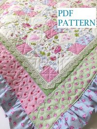 "Adorable Baby quilt pattern with a cottage chic look. Pattern shows how to add a Colorful Ruffled edge to this baby girl quilt pattern. THIS IS FOR A PATTERN ONLY (NOT THE FINISHED QUILT). INSTANT DOWNLOAD ONLY: not mailed - download following etsy instructions. Our Quilt Pattern Tutorial includes detailed instructions along with several \"as you quilt\" block images, quilt images, outlines, and instructions on a french seam for ruffle. Skill Level: Intermediate Use of rotary cutter and sewing