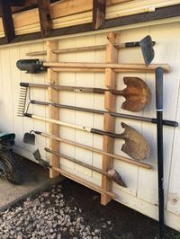 This is a guide to making a cheap and simple garden tool rack. This one is for my dad's shed and keeps all the tools safely of the floor. #diyshed