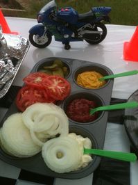 Condiments in a muffin tin.