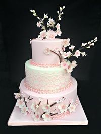 Cake is done by http://www.mariasdreamcakes.com/ The Cherry Blossoms are made by me :) https://www.etsy.com/listing/220534275/3-gumpaste-cherry-blossom-branches-for?ref=shop_home_active_18