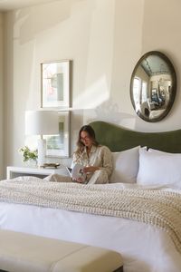 Discover the beauty of a neutral bedroom elevated by subtle touches of green! This serene space features a stunning green bed frame that anchors the room with elegance and charm. Complementing the bed are delicate touches of green in the floral arrangements and art pieces, creating a harmonious and refreshing atmosphere. Soft beige linens, warm wooden accents, and cozy textures complete the look, making this bedroom a perfect retreat for relaxation and tranquility. Making this the perfect bedroom inspiration.  . . . . . bedroom inspo, bedroom inspiration, cozy bedroom, simple bedroom, bright bedroom, bright spaces, bedroom ideas, ideas for bedroom, green bedroom, neutral bedroom, natural bedroom, bedroom layout, bedframe ideas, bedframe inspo, colorful bedframe.