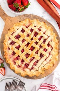 Savor the harmony of sweet strawberries and tangy rhubarb in every bite of our homemade strawberry rhubarb pie. A delightful summer treat that's simply irresistible. 🍓🥧 #StrawberryRhubarbPie #HomemadePie #SummerDessert