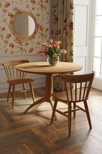 Fusing both contemporary and more traditional design elements; the Laura Ashley Brecon Extending Round Dining Table features an elegantly turned solid oak pedestal and four equally spaced legs crafted in a gentle arc shape. The generously sized table top has a chamfered edge and is finished in a rich European oak veneer and boasts a useful centre leaf which is stored separately.  The table has a natural oil finish which helps enhance the characteristics of the oak. Only the top needs to be atta…