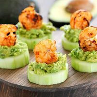 This Low Carb Avocado Shrimp Cucumber Appetizer has a base of sliced cucumber, then mashed avocado and topped off with spicy grilled shrimp. SO good and easy!