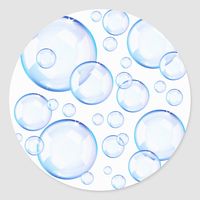 Transparent blue soap bubbles over white background