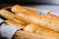 Learn how to make the best sourdough bread sticks with this step-by-step guide! Perfectly fluffy and tender on the inside with a delicious garlic butter on the outside. This easy-to-follow recipe will have your family raving. #farmhouseonboone #sourdoughbreadsticks #breadsticks #sourdough