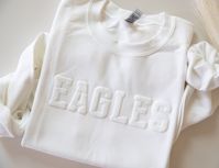 Custom Team Name Sweatshirt, Mascot Sweatshirt, Puff Print, Embossed Print, Gift for Mom, Christmas Gift Idea, School Spirit Sweatshirt The main listing image (EAGLES) is white sweatshirt, white puff text CASE SENSITIVE For your order to appear like our listing photo, you must write your text to us IN ALL CAPS Example: EAGLES ... NOT Eagles. If its sent to us as 'Eagles', it will print this way    DETAILS    Our Personalized Team Name Sweatshirt boasts an exceptional level of softness and comfor