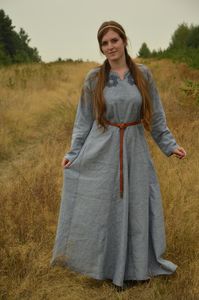 New early medieval dress made of linen 100% with delicate embrionery near neckline. The cut is typical for Viking women. Thanks to natural, breathable fabric, it's perfect for both summer days and cool weather, wearing it under woolen dress. Dress has narrow and comfortable sleeves. Two gussets on both sides and gussets in front of the dress and at the back, make it wider at the bottom. Unvisible stitches are made by machine and all visible by hand. Dress is made for the order. If there's no col