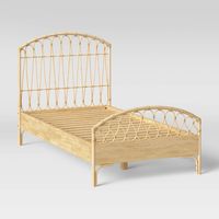 Add natural charm to their bedroom with this Natural Brown Twin Rattan Bed from Pillowfort™. This twin bed with a low profile makes a comfortable addition to their bedroom interiors. It features a curved headboard and a footboard made from rattan to add a touch of breezy design and textured appeal. The lightweight bed in a natural color easily coordinates with any decor. Pair with a range of printed or solid sheets and a mattress to complete their comfy bedscape.