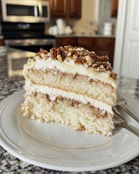 Ingredients:  2 1/2 cups flour 2 tsp baking powder 1/2 tsp salt 1 cup butter, softened 2 cups sugar 4 egg whites 1 cup milk 1 tsp vanilla 4 oz melted white chocolate Frosting:  1/2 cup evaporated milk 1/2 cup sugar 2 egg yolks 1/4 cup butter 1 cup coconut, 1/2 cup pecans Directions:  Preheat oven to 350°F (175°C). Grease two 9" pans. Cream butter, sugar; add egg whites. Mix in chocolate, vanilla. Alternate adding flour and milk. Bake 25-30 min. Cook milk, sugar, yolks, butter; add coconut, pecans. Cool and frost. ⏰ Total: 1 hr 30 min | 🔥 450 kcal/serving | 🍽️ Serves: 12  #GermanChocolateCake #CoconutPecan #WhiteCake