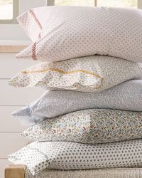 Our Micro-Print Organic-Cotton Percale Sheets combine the unrivaled softness of 400 thread count organic cotton with the cool, crisp hand of traditional percale — for a sleep experience unlike any other. Exceptionally designed with micro-prints for effortless mix-and-match style plus hand-embroidered detailing for special artisan flair.