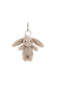 Hop into cuteness with the Bashful Bunny Beige Bag Charm from Jellycat! This petite plush charm features Jellycat's classic Bashful Bunny design, with velvety beige fur, floppy ears, and a sweet embroidered nose. Its irresistibly soft texture makes it a delightful accessory for any bag, backpack, or set of keys. Complete with a sturdy silver clip, this charming bunny is ready to accompany you wherever you roam. Perfect as a thoughtful gift or a playful addition to your own collection, it's bound