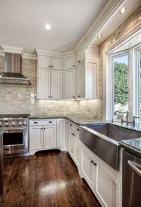 Kitchen. Kitchen ideas. Home. Home ideas. Window in kitchen. Wood floors. Cabinets. Storage. Farmhouse sink. White kitchen.