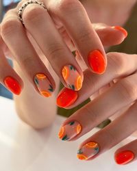 Embrace a colorful nail aesthetic this summer with these pretty orange nails! From trendy nail art to simple designs, discover the perfect ideas for your next manicure! For example, we love these short fruit nails.