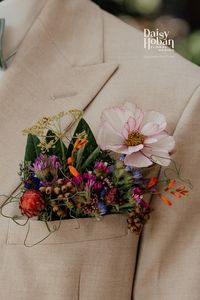 Buttonhole, boutonniere alternative for grooms and ushers wedding outfit flowers. Flowers in a pocket also called a pocket meadow flower style. Natural, untraditional and stylish.