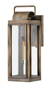 Sag Harbor 120V Outdoor Wall Sconce unites updated elements with time tested details. A clean, simple cage in Burnished Bronze, Black, or Antique Brushed Aluminum anchors a knurled brass socket to forge an unforgettable mixed metal look. Durable, aluminum construction combines with Clear glass panels to create a beacon of enduring style. Images are for reference purpose only and may not be pictured with the specified LED filament bulb. LED included option is JA8 2016 certified.