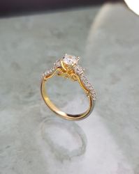 A very unique and special hand carved diamond engagement ring for once in a life time moment , 18k hand crafted gold with GIA certified central diamond in various sizes , 0.30ct , 0.40ct , 0.50ct , 0.70ct , 0.90ct ,1.00ct and 0.39ct round diamonds. Every ring comes with the GIA central diamond certificate and a unique certificate for the gold carats and all the diamonds combined.