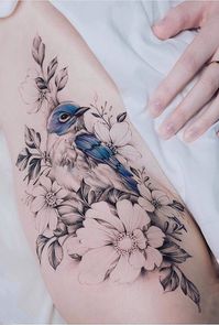 For floral tattoo, all the flowers are black & white, except for one.