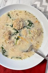 Gnocchi, Spinach, and Meatball Soup | "This is one of those soup dishes ideal for warming the soul during a winter day. This is similar to an Italian wedding soup but creamy with meatballs and potato gnocchi. I make my own chicken stock and meatballs but you can use store-bought." #souprecipes #soupinspiration #soup #stew #chili #soupideas