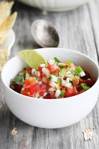 Bold lime juice, cilantro, jalapenos and habanero make this Garden Tomato Salsa amazing. Every bite is full of fresh tomatoes, peppers and flavor.