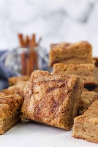 These cinnamon roll blondies are chewy homemade blondies swirled with gooey cinnamon sugar, with all the flavors of a classic cinnamon roll! #cinnamonroll #blondies #homemade