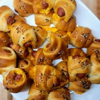 Fancy Pigs in a Blanket - Take these tasty appetizers to the next level with some sharp cheddar and dijon rolled in