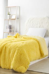 Make your dorm bedding bright and bold with this Sunshine Yellow Comforter! Cozy faux feathers and a fun yellow color make the perfect combination for bright and cheerful bedding!