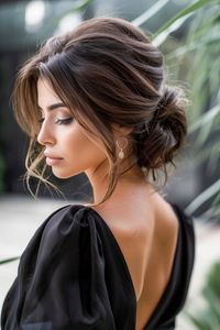 A sophisticated low bun in sunkissed brunette, graced with subtle sun-kissed accents, offers an understated yet elegant style. This hairstyle is a masterclass in simplicity and elegance, with the sun-kissed accents adding a gentle radiance. Ideal for formal and casual settings alike, it showcases how minimalistic touches can transform a classic look into something truly special.