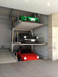 Porsche Garage Storage. If I had 3 Porsches and a stacking system like this, they sure as hell wouldn't be in a crappy "storage unit" syle garage ... uuugh!