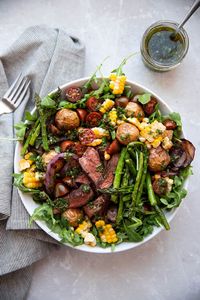 Chimichurri steak salad time! Tender sirloin steak, crispy gold potatoes, tomatoes, fresh corn off the cob, asparagus, grilled red onion, and the freshest most delicious chimichurri sauce. Oh yeah, this chimichurri steak salad wins an award for most awesome salad ever. #salad