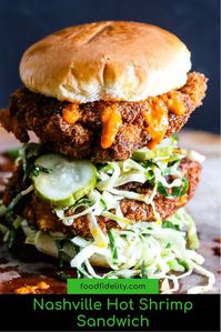 Nashville Hot Chicken meets Japanese Ebi Katsu Burger (shrimp cutlet burger) for a spicy, succulent panko crusted shrimp sandwich with tangy collard greens slaw. #nashville #hotsandwich #shrimp #seafood #nashvillehot #dinner #sandwich #EbiKatsuBurger #foodfidelity www.foodfidelity.com