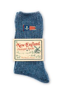 Put your coziest foot forward in our limited edition New England donegal socks. It's our spin of the yarn take on an Irish classic. We kept the signature feel and flecks you're used to in a donegal but added a distinctly New England touch with our seaside embroidery. Product Details: One size fits most Wash cold, lay flat to dry 10% Cotton, 10% Wool, 25% Nylon, 55% Acrylic Imported Please note, we do not accept returns on our New England Donegal Socks. All purchases are final.