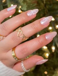 hailey bieber chrome gel x acrylic nails coquette bow snowflake christmas holiday