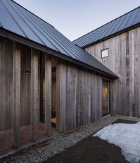 LAMAS builds contemporary Canadian farmhouse with reclaimed timber