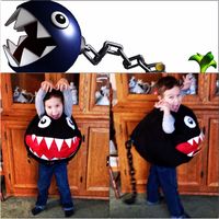 Home made costume my mom made for my son. Chain Chomp from Super Mario Bros. Made from scratch, no pattern. Teeth are cut from margarine container lids, tail base is the bottom of a black takeout container and the tail is a plastic chain bought at the dollar store in the Halloween section. He loves it!!